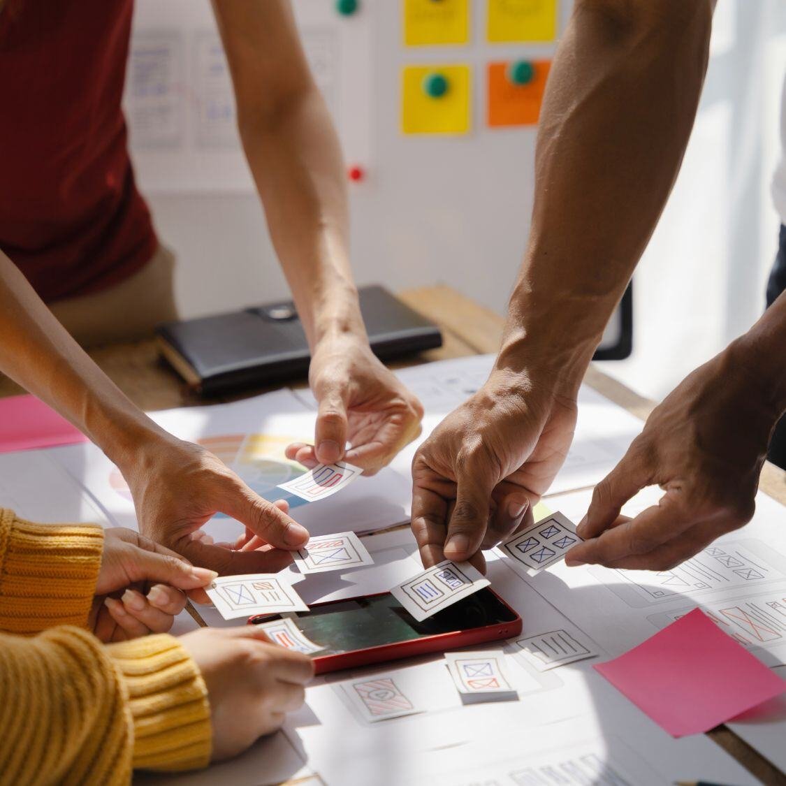 A team of dedicated marketers showing the teamwork involved for successful ad agencies. 