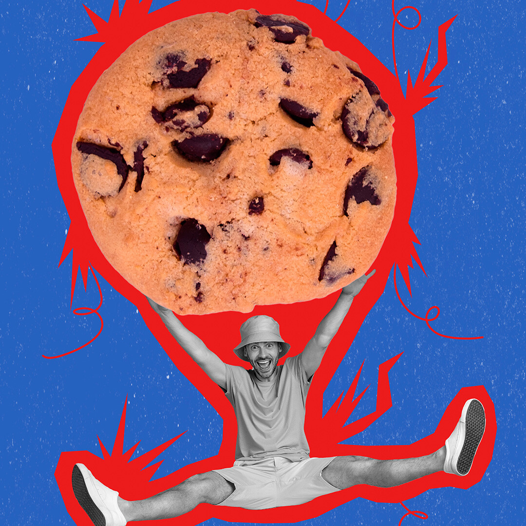 Man clinging to a giant chocolate chip cookie, symbolizing data 'cookies' in digital advertising and the shift to privacy-first marketing strategies.