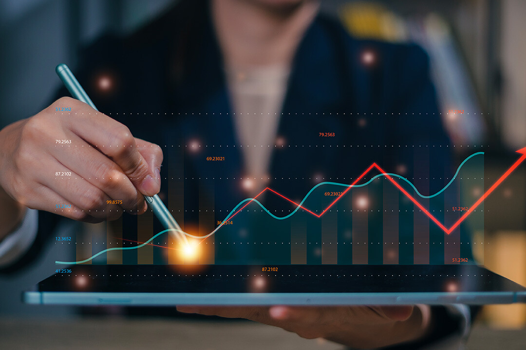 A marketing professional analyzes business intelligence from advanced analytics to inform strategy