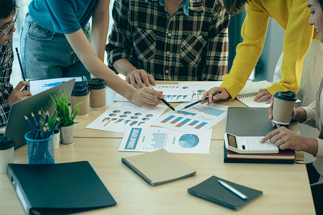 Charts and graphs display predictive modeling spread out across a table